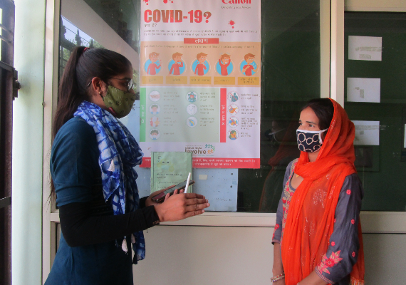 Canon volunteer with one of the members from adopted village in Maheshwari